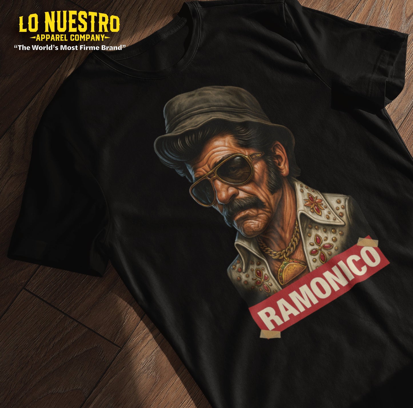 Funny Mexican shirt laid flat on wood with Ramonico parody graphic, showing off a vintage mashup design on a black tee.