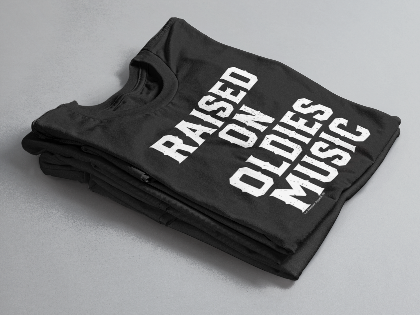 Close-up of the graphic on the "Raised on Oldies Music" T-shirt showing detailed text artwork.