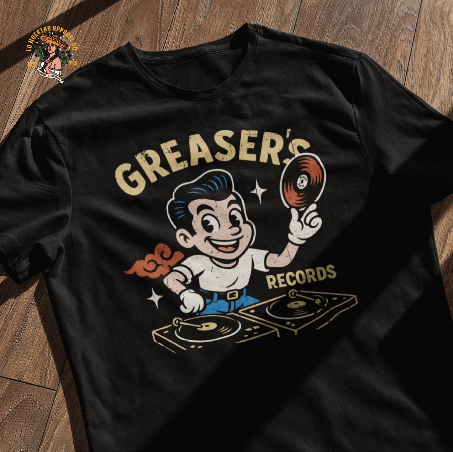 Greaser’s Records funny Mexican shirt on wooden floor mockup. Vintage cartoon greaser design perfect for old-school streetwear vibes.