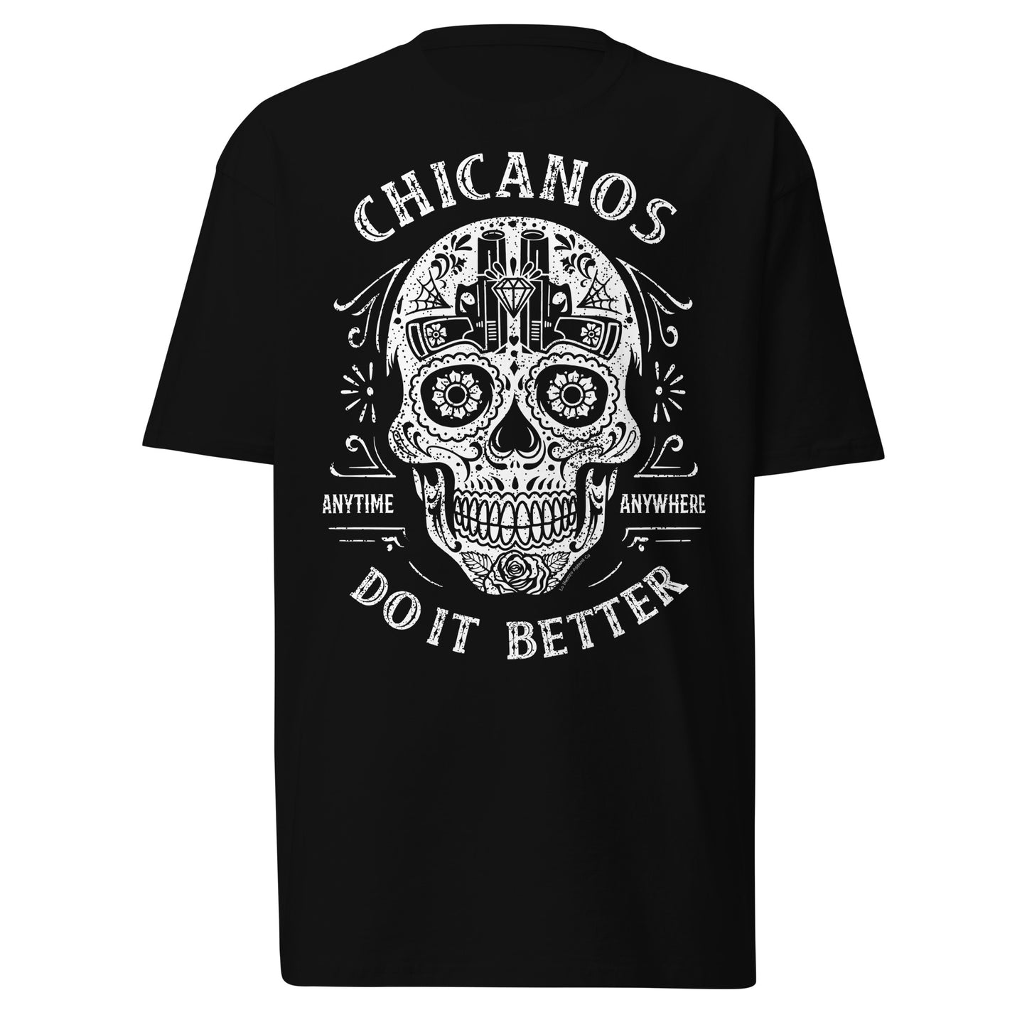 Front view of black "Chicanos Do It Better" T-shirt featuring a sugar skull design with text.
