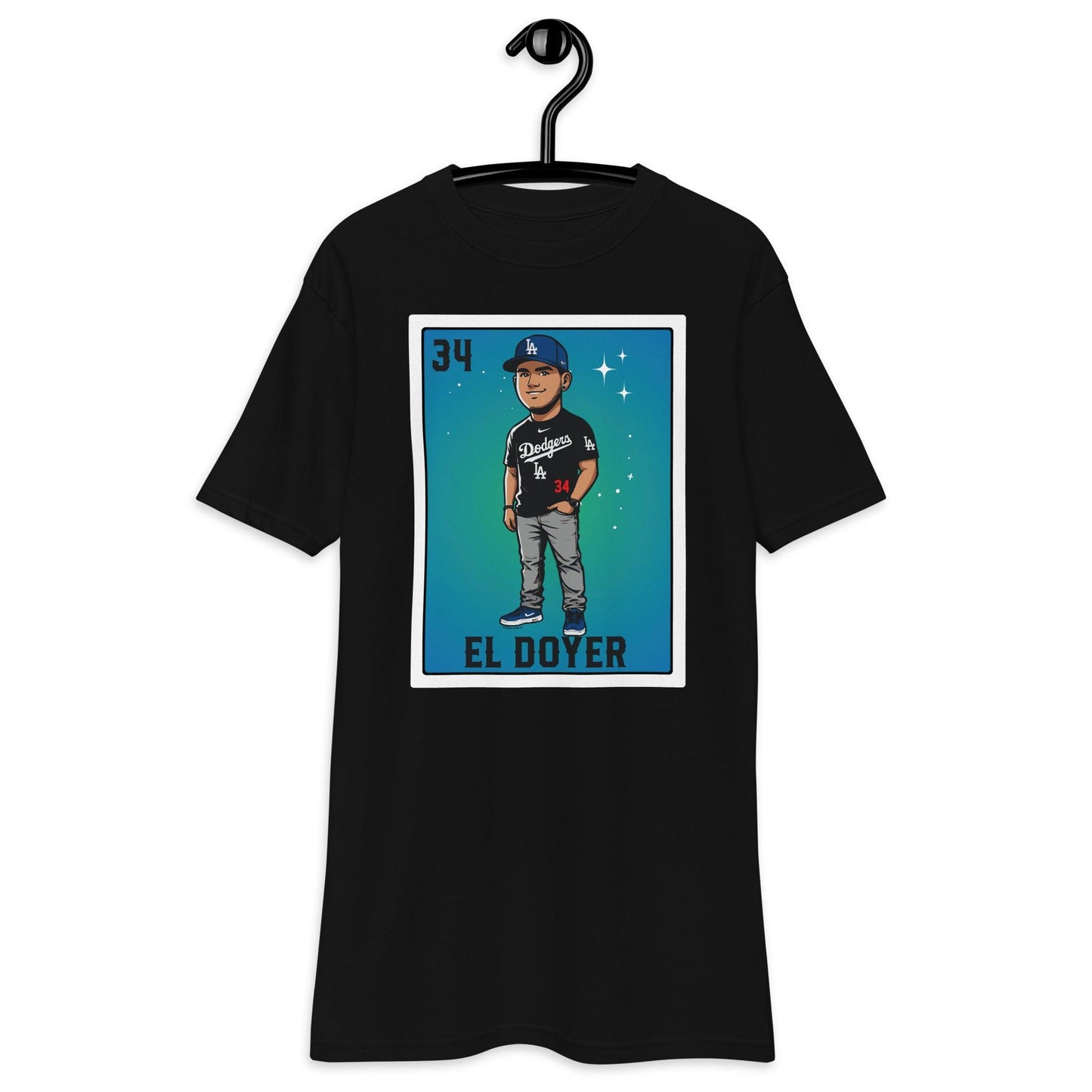 Black 'El Doyer' Loteria-style t-shirt on a hanger featuring a cartoon baseball player in a Dodgers-inspired outfit, displayed on a plain background.