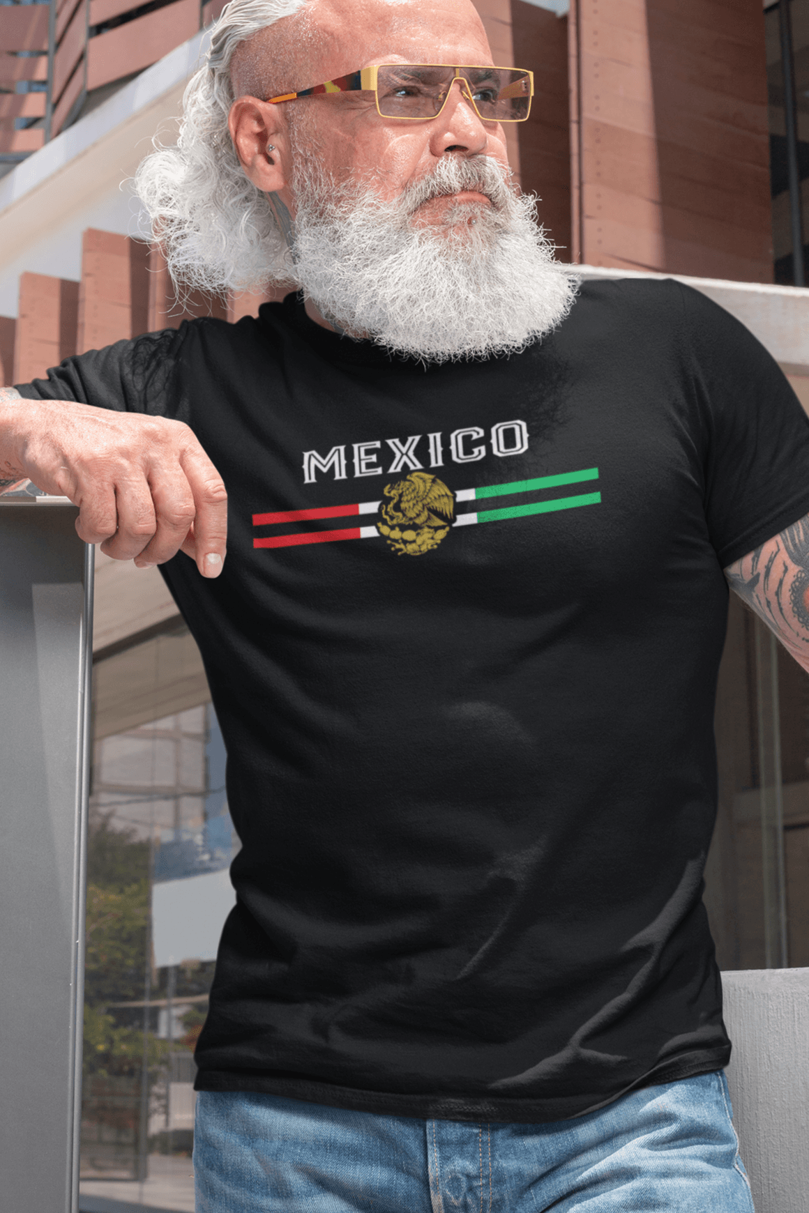 Older Male Model Wearing a Mexico T-Shirt – Mexican Heritage Streetwear in Black with Golden Eagle. Perfect for anyone that likes Chicano Clothing or Funny Mexican Shirts.