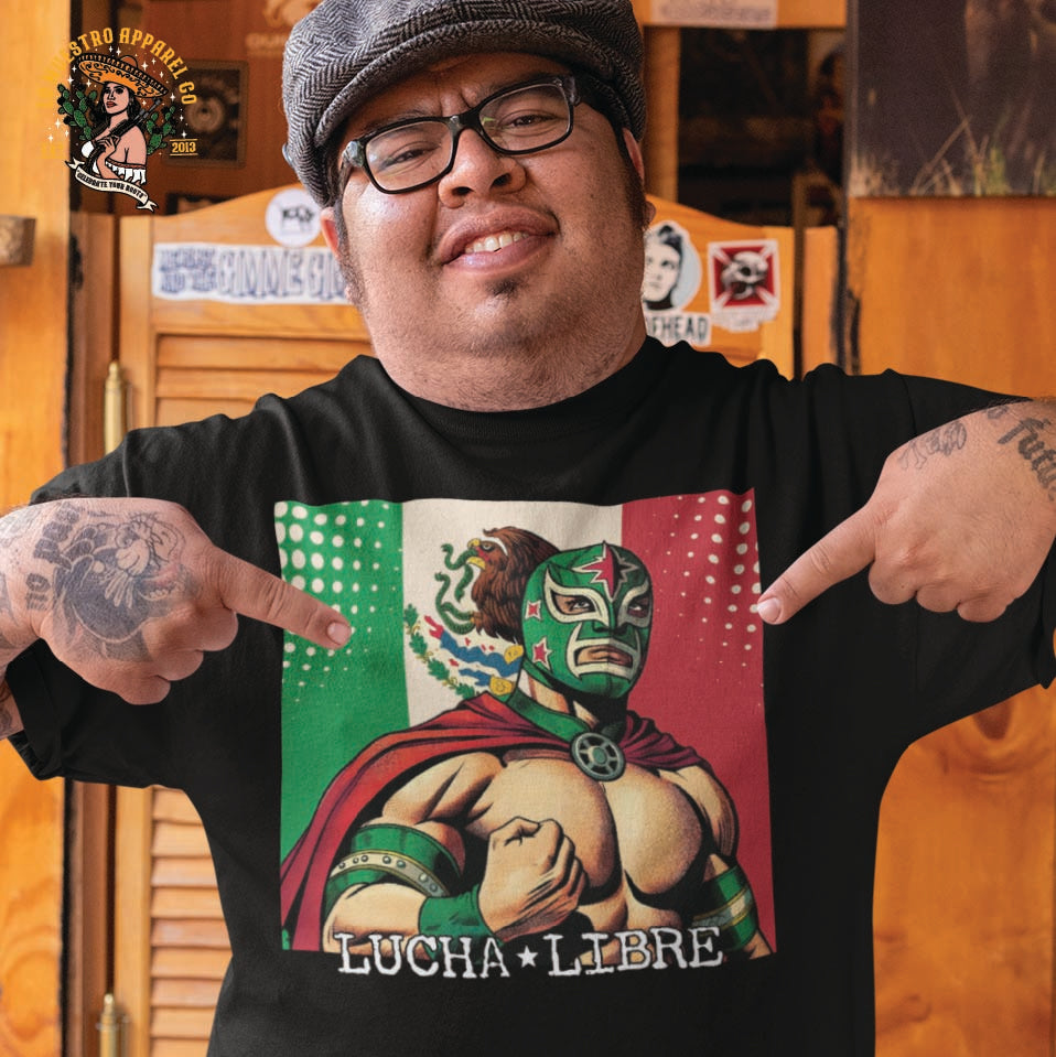 A Hispanic male model wearing the Lucha Libre Luchador Shirt, depicting a colorful Luchador. Lo Nuestro Apparel Co brings quality premium cotton to all the funny Mexican T shirts and Chicano clothing.