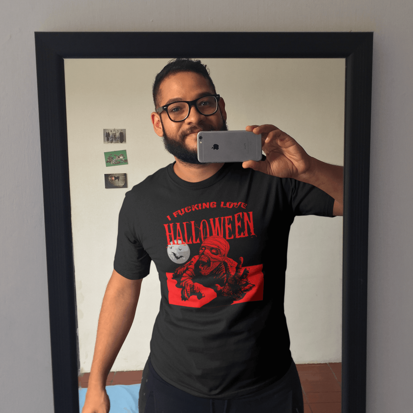 Man taking a selfie in mirror wearing I Fucking Love Halloween Men's T-Shirt – Funny Halloween T-Shirt, Sarcastic Halloween Shirt, Stylish Halloween Wear.