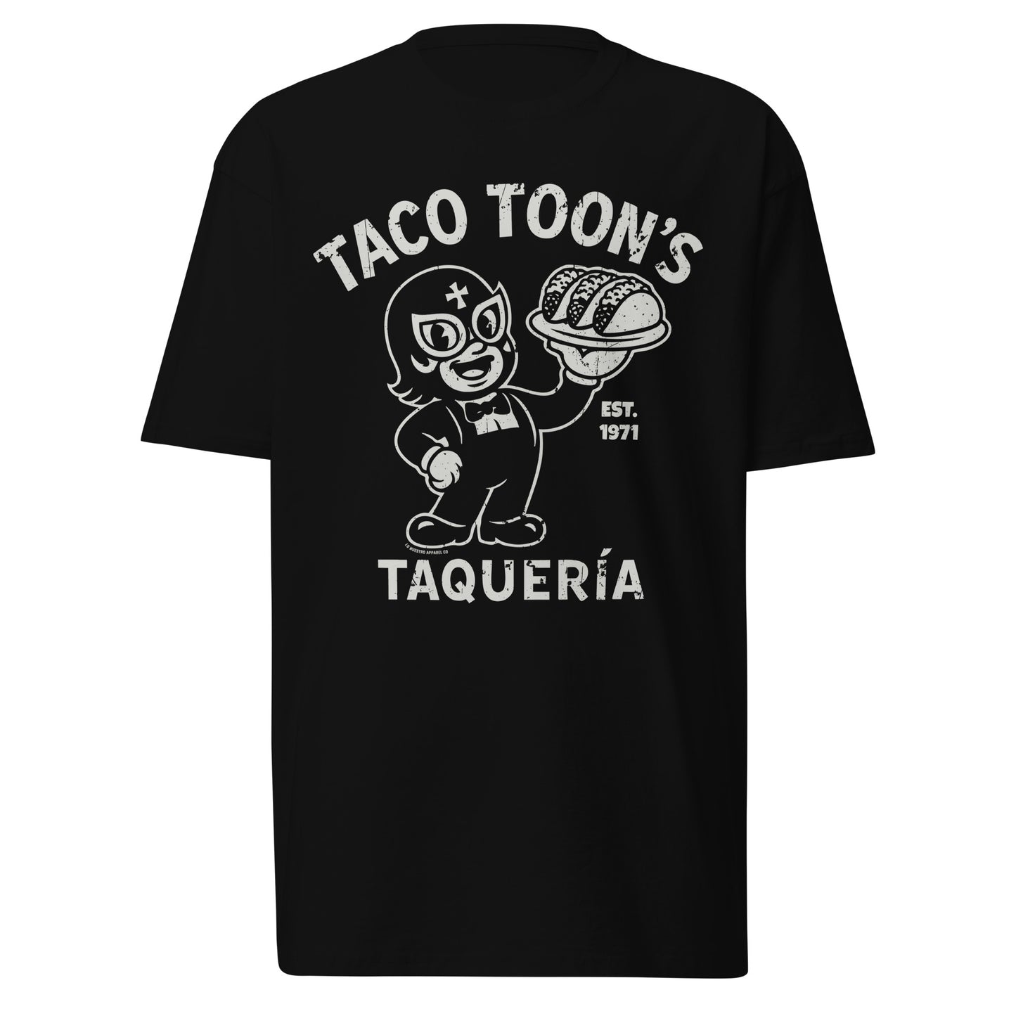 Taco Toon’s Taquería funny Mexican shirt on a white background. Features a cartoon luchador holding tacos with vintage diner-style text.Product mockup