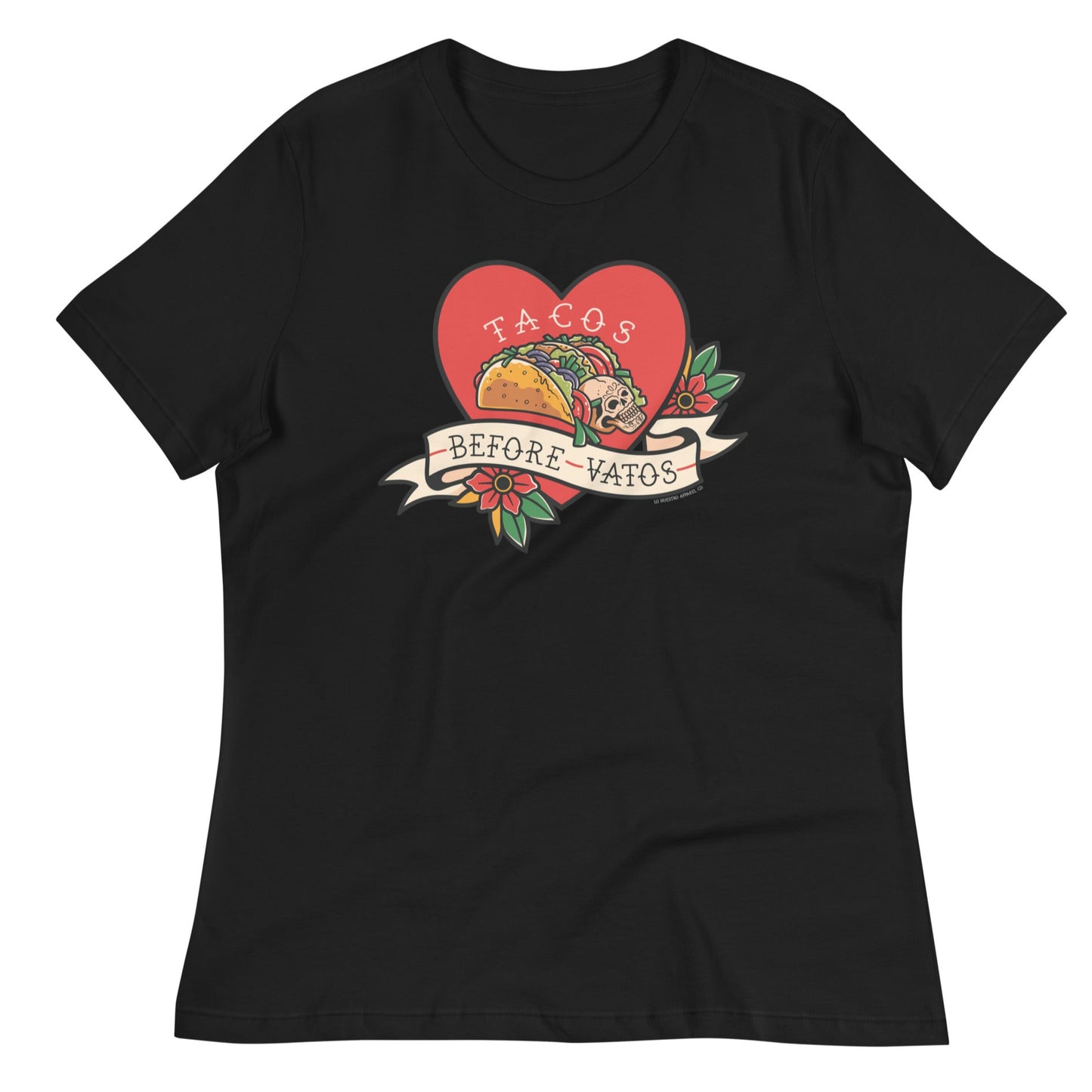 Black women's T-shirt featuring a "Tacos Before Vatos" design with a colorful taco inside a heart and floral details. Funny and stylish taco-themed graphic tee.
