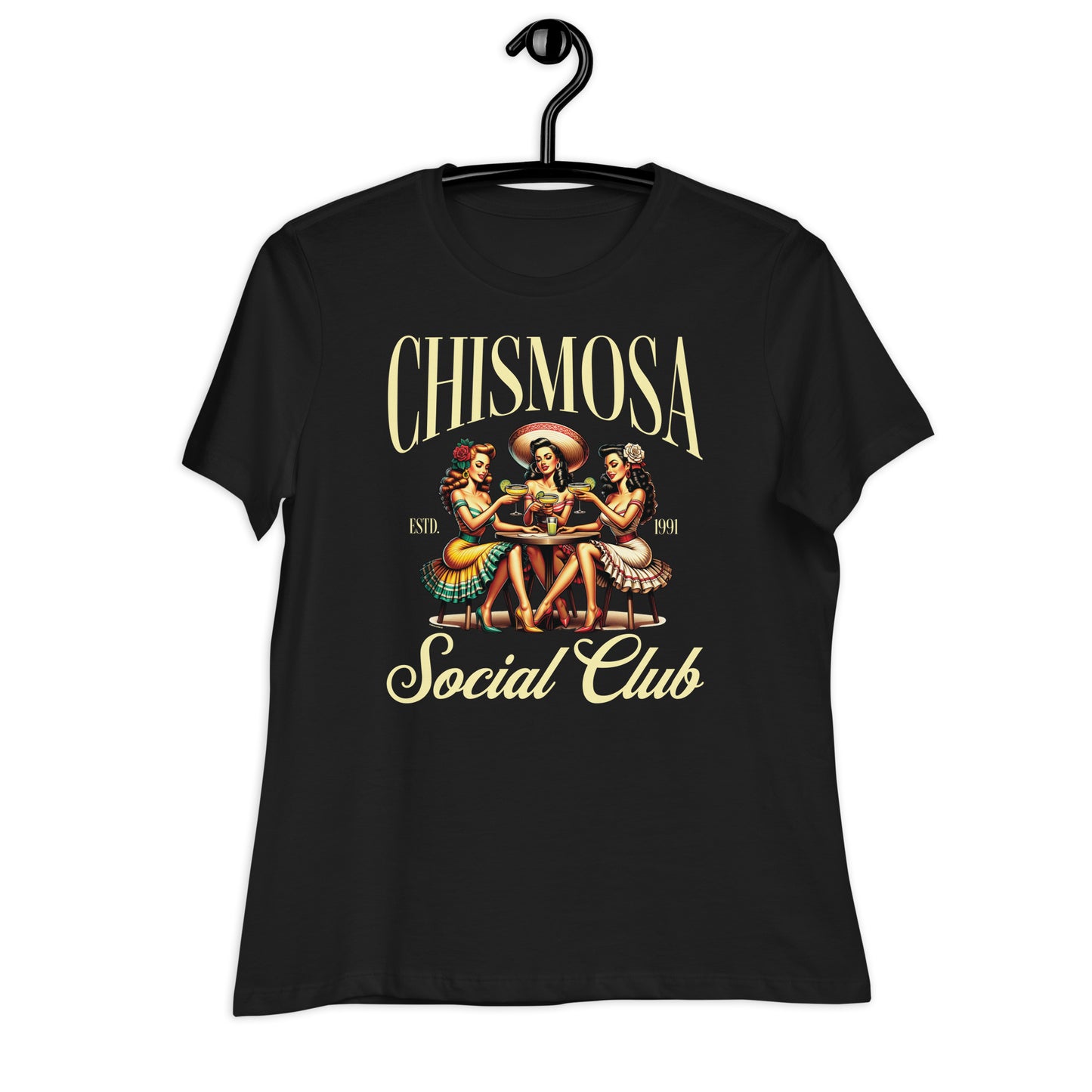 A close-up of a black t-shirt on a hanger with a pin-up women sitting at a table, holding margarita, surrounded by the text “Chismosa Social Club"