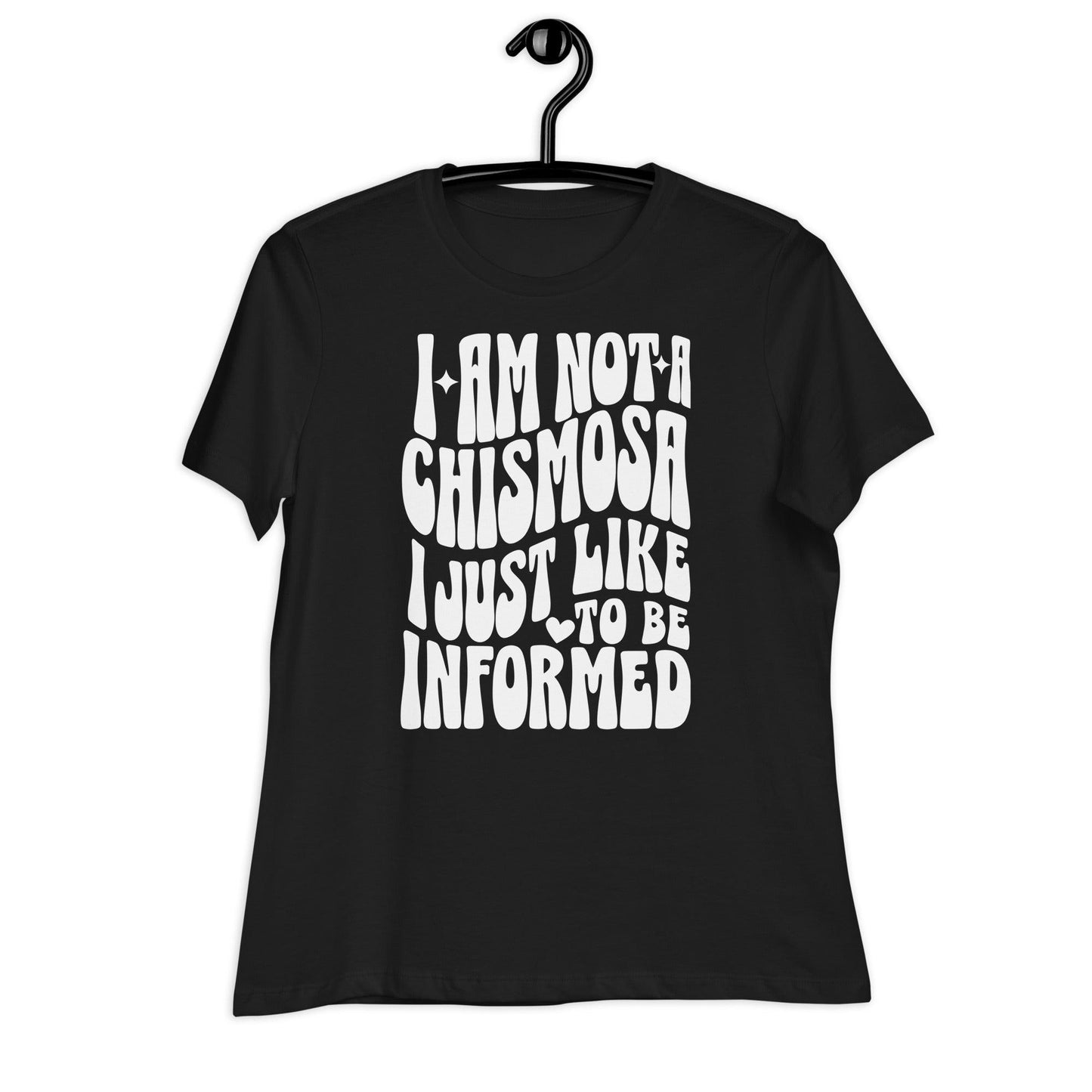 A black t-shirt on a hanger with text that reads, I'm Not a Chismosa I just Like to be Informed.