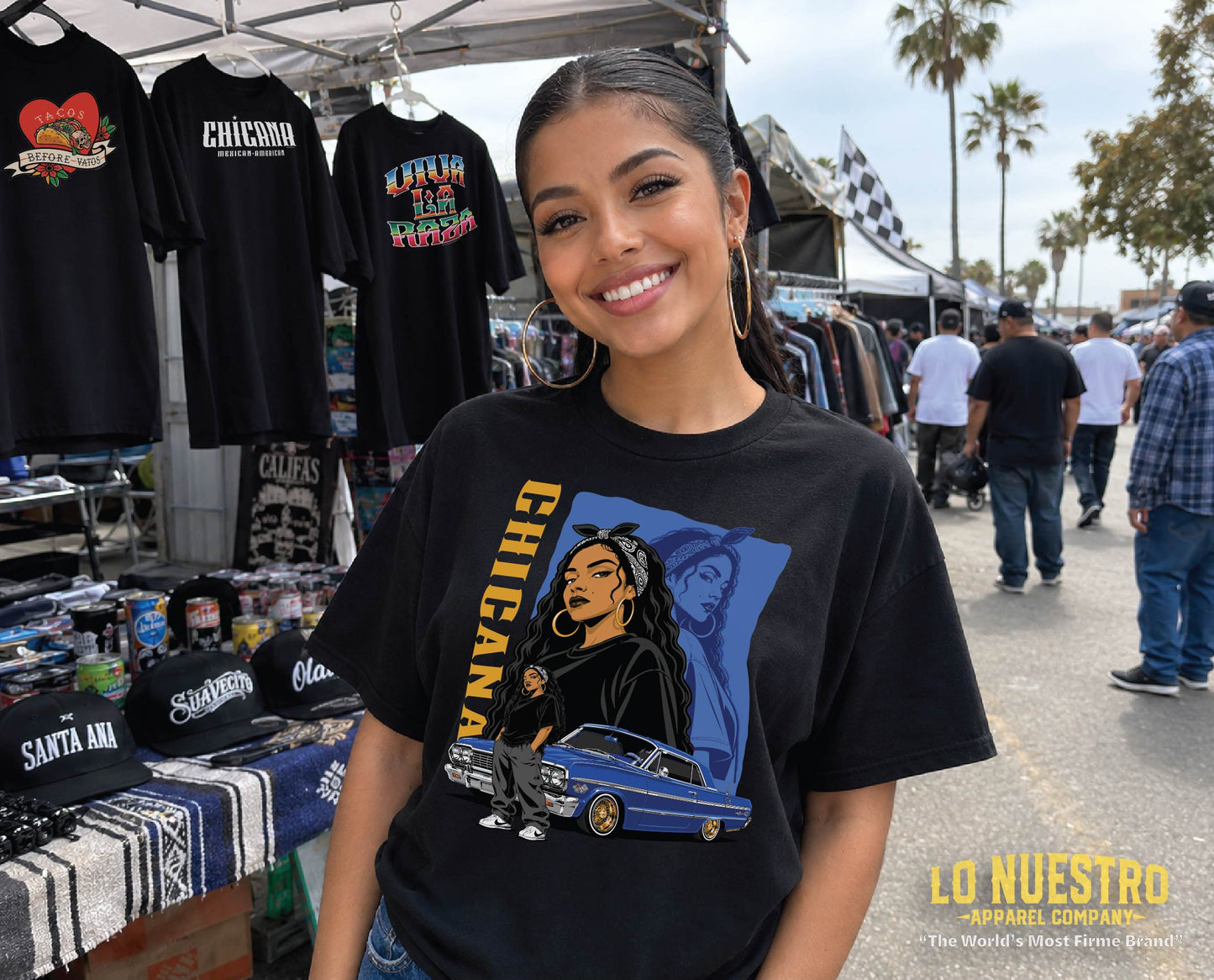 Chicana Bootleg Tee featuring a bandana-wearing Chicana, blue 1964 Impala lowrider, and vintage bootleg-inspired artwork on a black t-shirt.