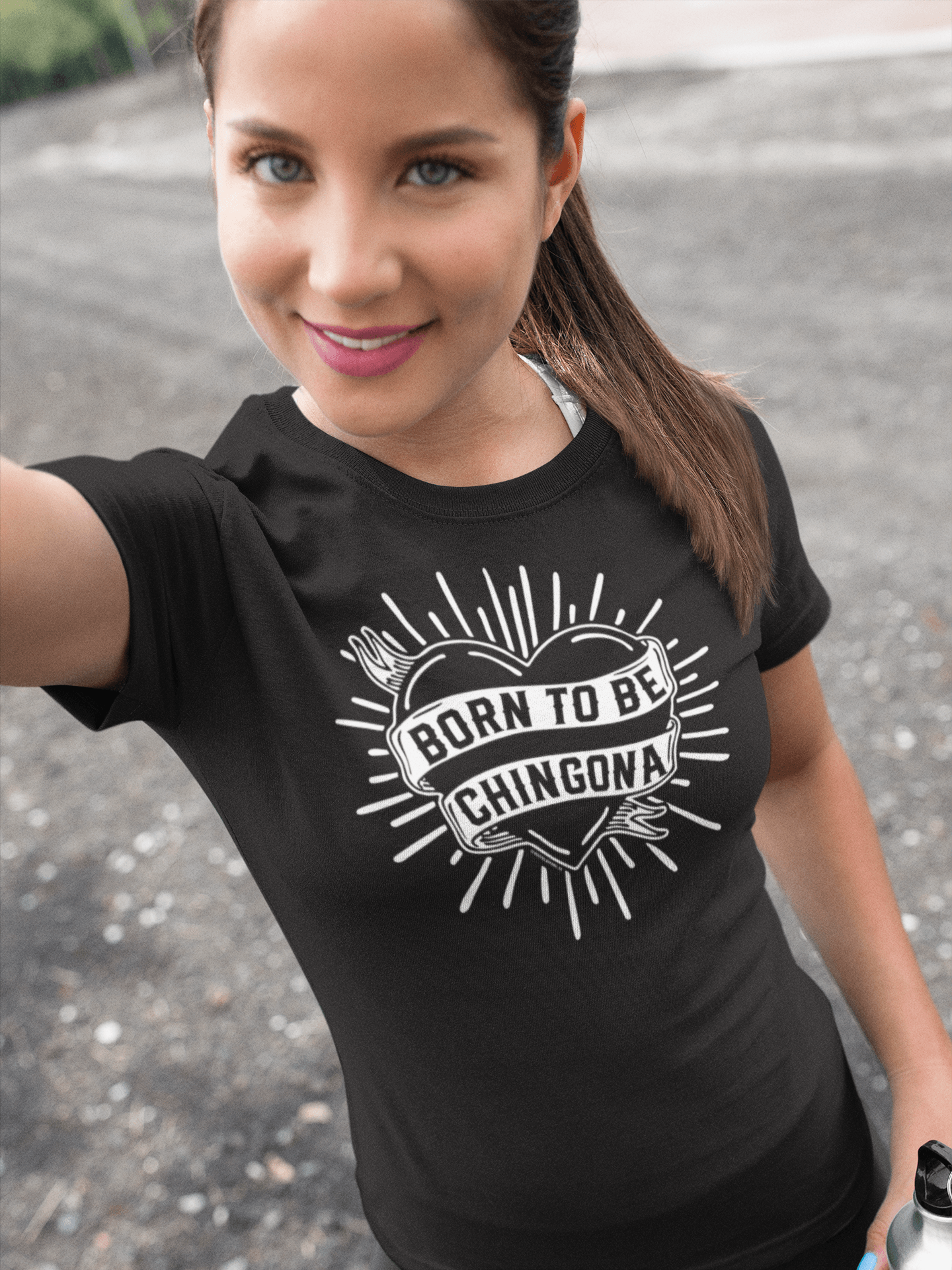 Woman wearing Born to Be Chingona tee, styled as a funny Mother’s Day gift for Hispanic moms.