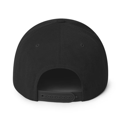 Close-up of the snapback closure on the Taquero hat, highlighting the adjustable fit and embroidered eyelets.