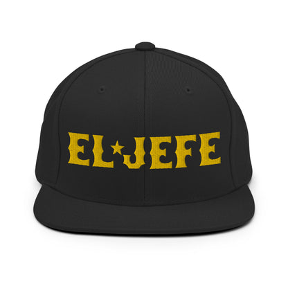 Black snapback hat with "El Jefe" text in yellow, featuring a flat bill and adjustable snapback closure.