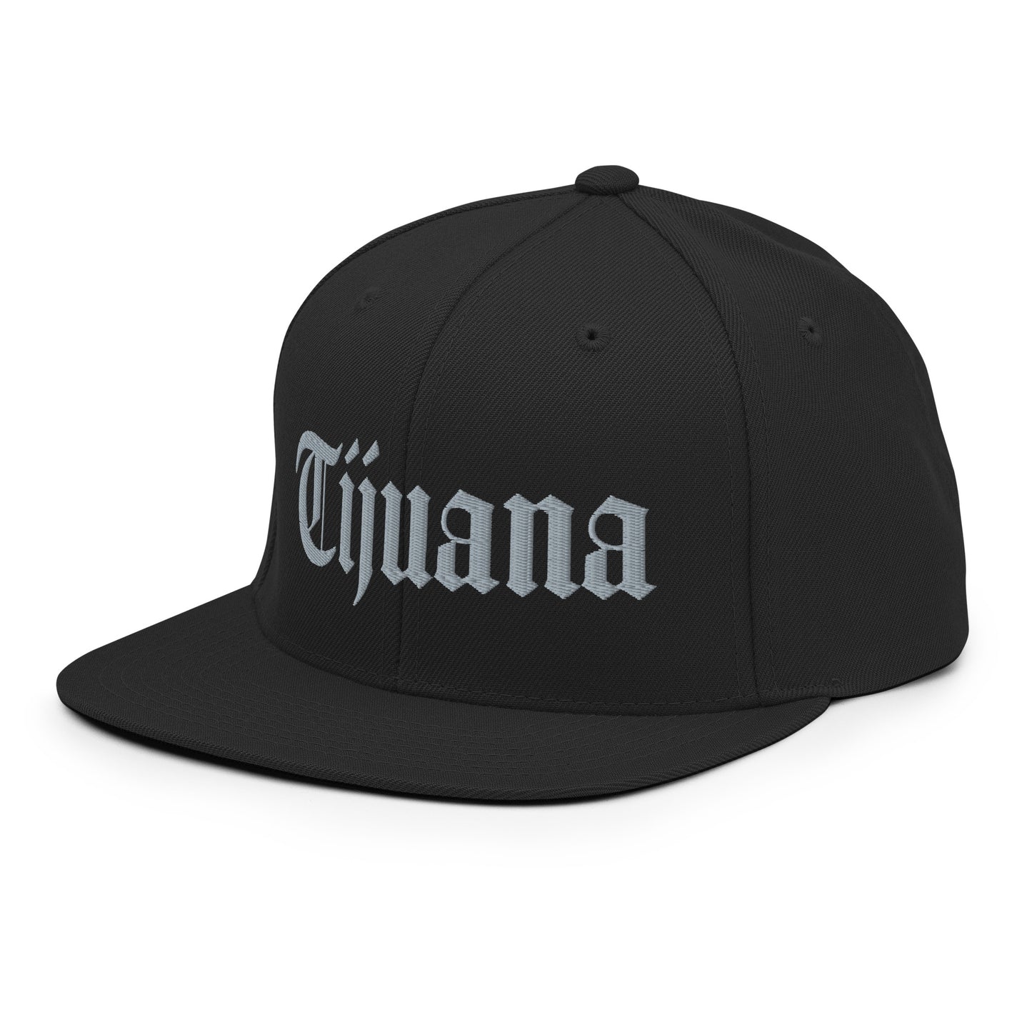 Black snapback hat with "Tijuana" text in old English embroidery, adjustable fit, adding a bold touch to urban streetwear.