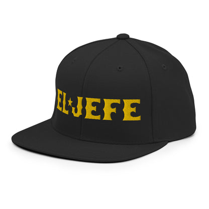 Black snapback hat with "El Jefe" text in yellow, featuring a flat bill and adjustable snapback closure.