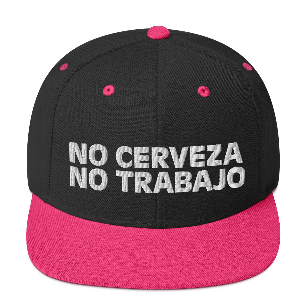 Black snapback hat with neon pink "No Cerveza No Trabajo" text, adjustable fit, inspired by a comedy starring a Chicano comedian. Perfect for men, includes "No Cerveza No Trabajo" meaning.