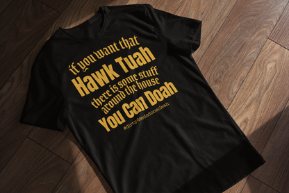 Close-up of a black women's t-shirt with yellow text saying: 'If you want that Hawk Tuah, there is some stuff around the house you can doah,' showcasing the shirt's soft fabric and bold design.