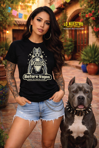 Hispanic woman wearing Doggos Before Vagos t-shirt standing with pitbull in Mexican courtyard