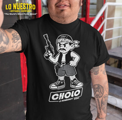 Tattooed man wearing a funny Mexican shirt with a parody character holding a space blaster and the text Cholo: A Homeboy Story.