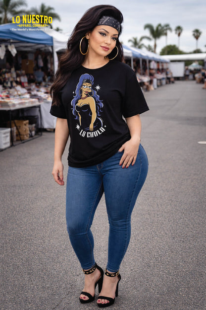 Latina model wearing La Chula graphic t-shirt at a swap meet, black relaxed fit streetwear tee with pin-up design