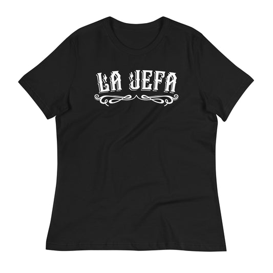  La Jefa Shirt laid flat with a natural wrinkled texture, featuring a bold Chicana graphic tee design. A must-have for mujeres repping Jefa energy.