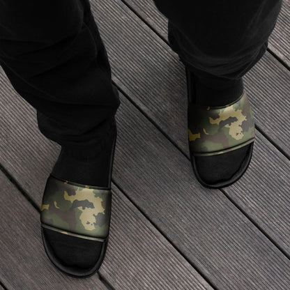 Man wearing men's camo slide sandals with a rugged military-style design. Comfortable slip-on slides perfect for casual wear.