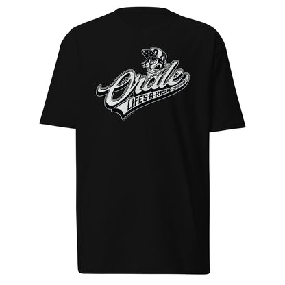 Front view of black "Órale Life's a Risk Carnal" T-shirt featuring classic baseball swoosh design.