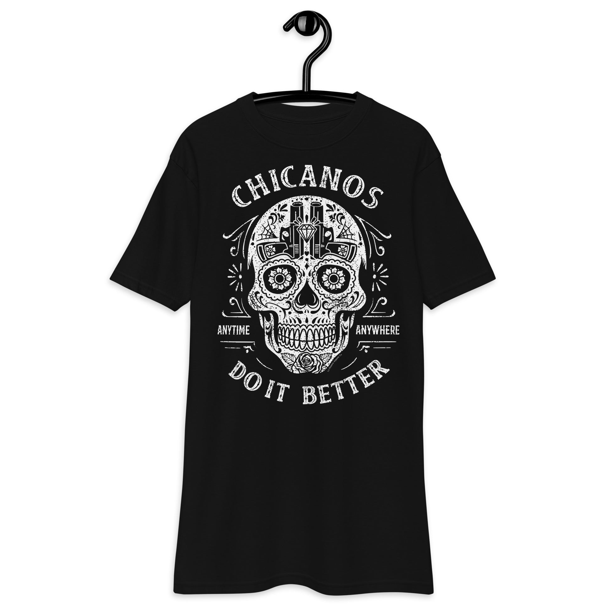 Front view of black "Chicanos Do It Better" T-shirt featuring a sugar skull design with text.