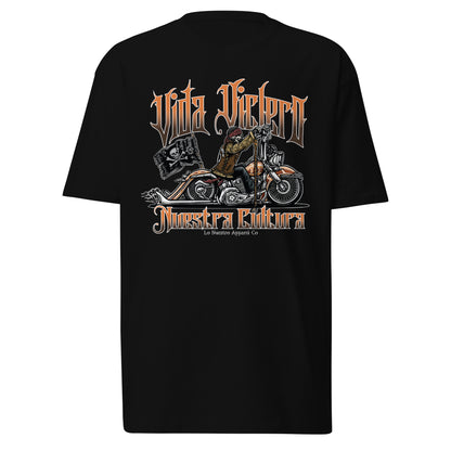 Front view of black "Vida Viclero" T-shirt featuring a skeleton riding a Vicla with "Vida Viclero" and "Nuestra Cultura" text.