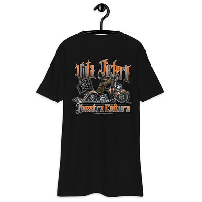 Front view of black "Vida Viclero" T-shirt featuring a skeleton riding a Vicla with "Vida Viclero" and "Nuestra Cultura" text.