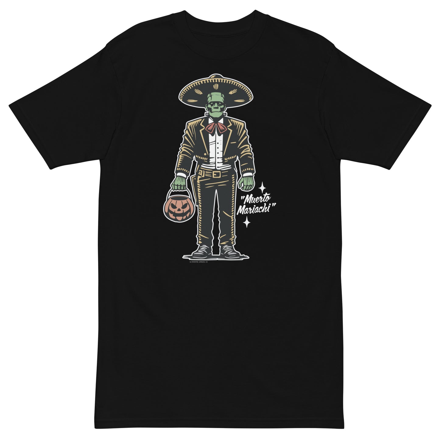 Black heavyweight t-shirt featuring a 'Muerto Mariachi' design, with a green zombie mariachi character dressed in traditional attire and holding a pumpkin bucket, in a retro Halloween style.