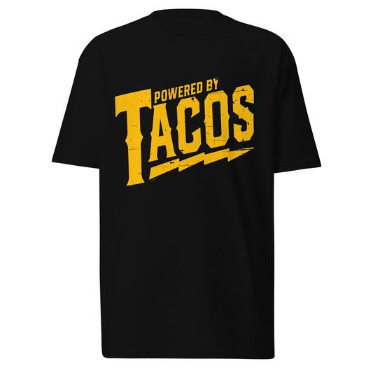 Front-facing view of a black graphic tee featuring bold 'Powered by Tacos' text with yellow lightning bolts for taco lovers.