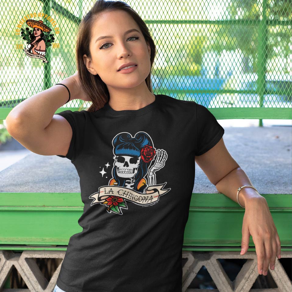 A young model wearing the La Chingona Tattoo Pin Up style T shirt. Lo Nuestro sells only the best in Funny Mexican T Shirts and premium Chicano Clothing.