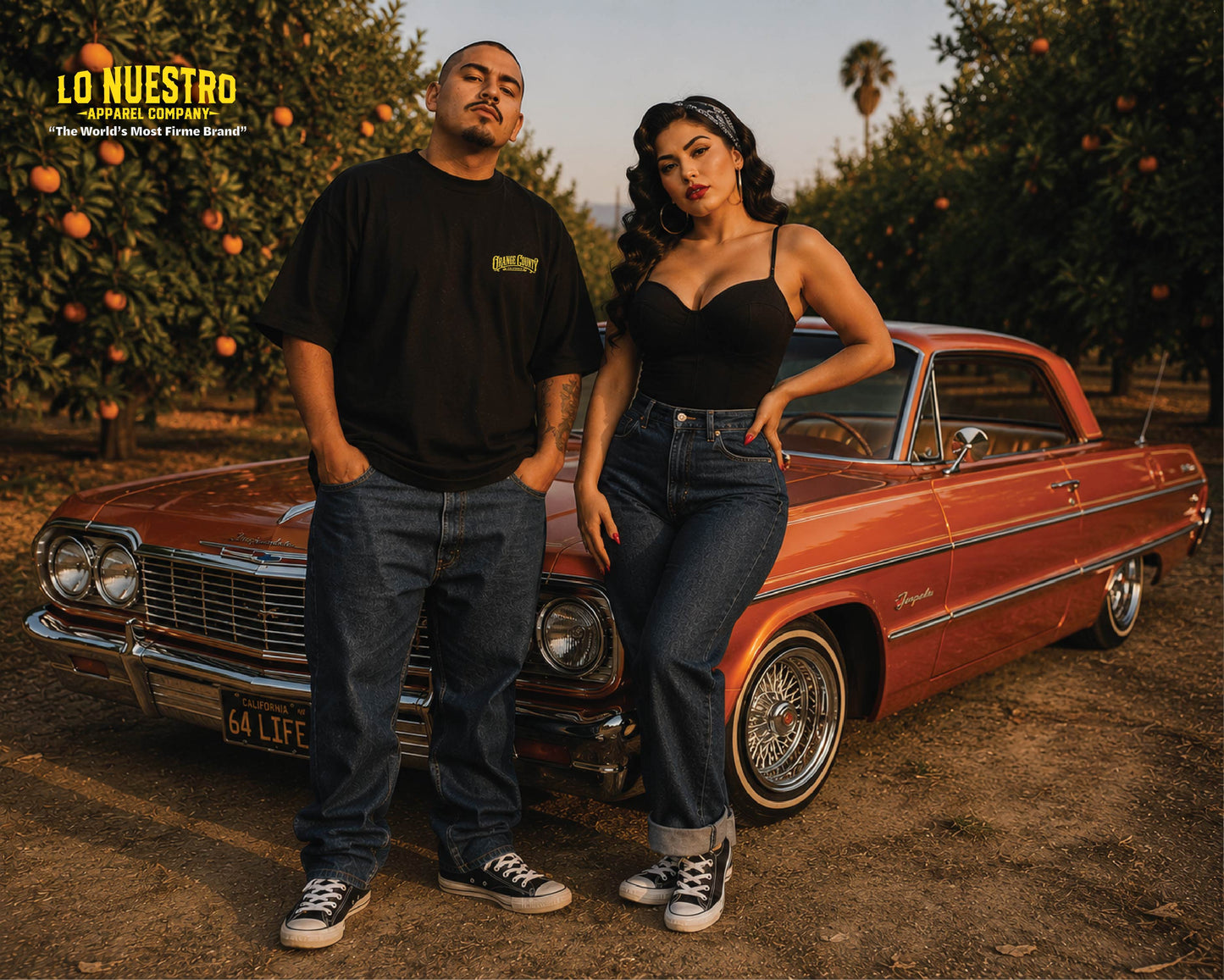 Model wearing the Orange County Plaque t-shirt standing in an orange grove in front of a candy orange 1964 Impala lowrider.
