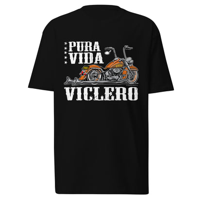 A black Pura Vida Viclero T-Shirt displayed against a white background. This biker t-shirt features a bold motorcycle graphic with vintage-inspired lettering, perfect for those who live to ride. A must-have in Chicano clothing, blending biker culture with firme streetwear. Ideal for fans of funny Mexican shirts who want to represent their roots with style.