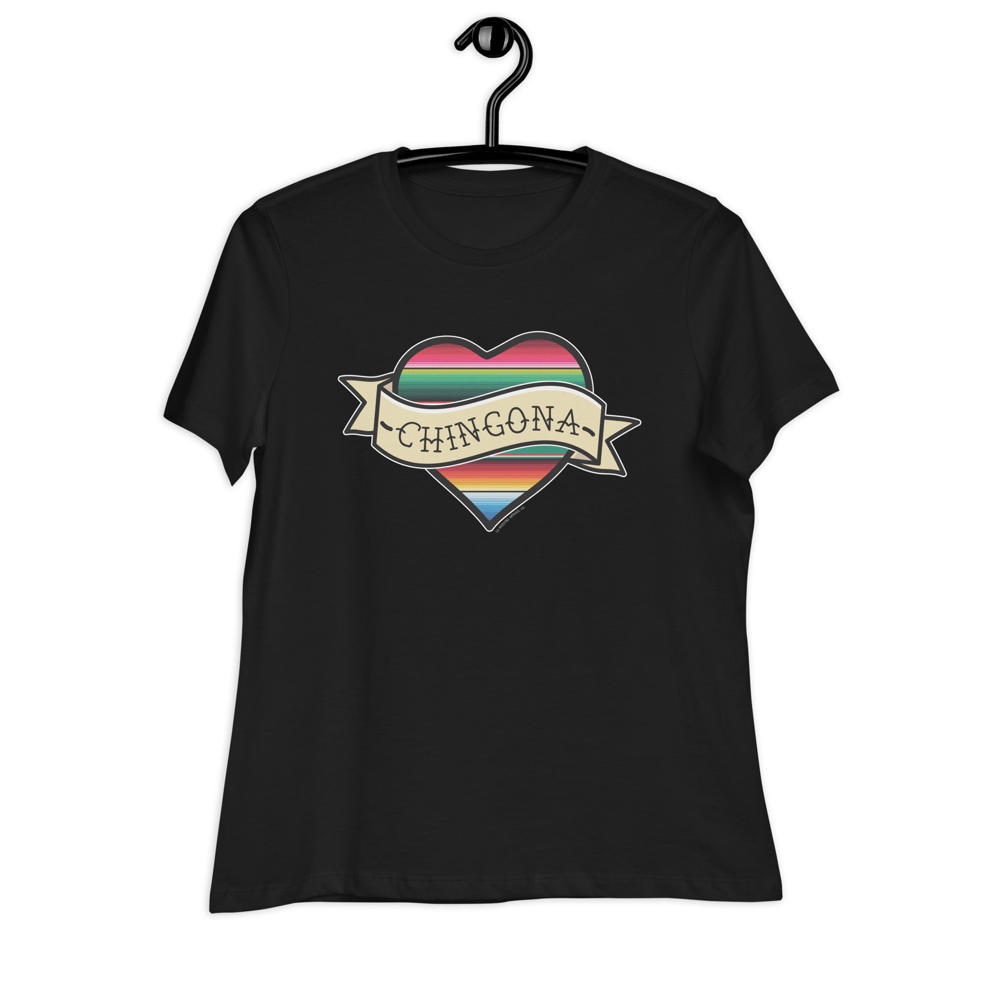 Black women's T-shirt featuring a serape heart and 'Chingona' text, displayed on a hanger.