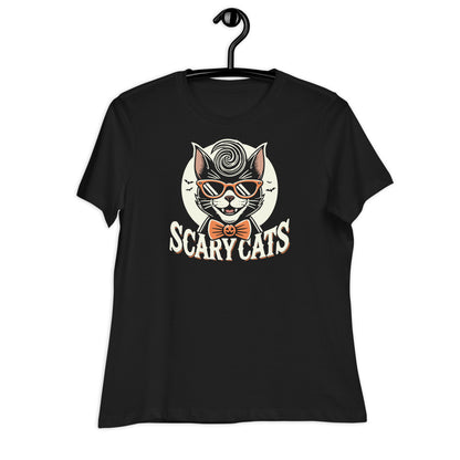 Black t-shirt hanging on a black hanger, featuring a retro 'Scary Cats' design with a cool cat in a greaser hairstyle, sunglasses, and jack-o-lantern bow tie.