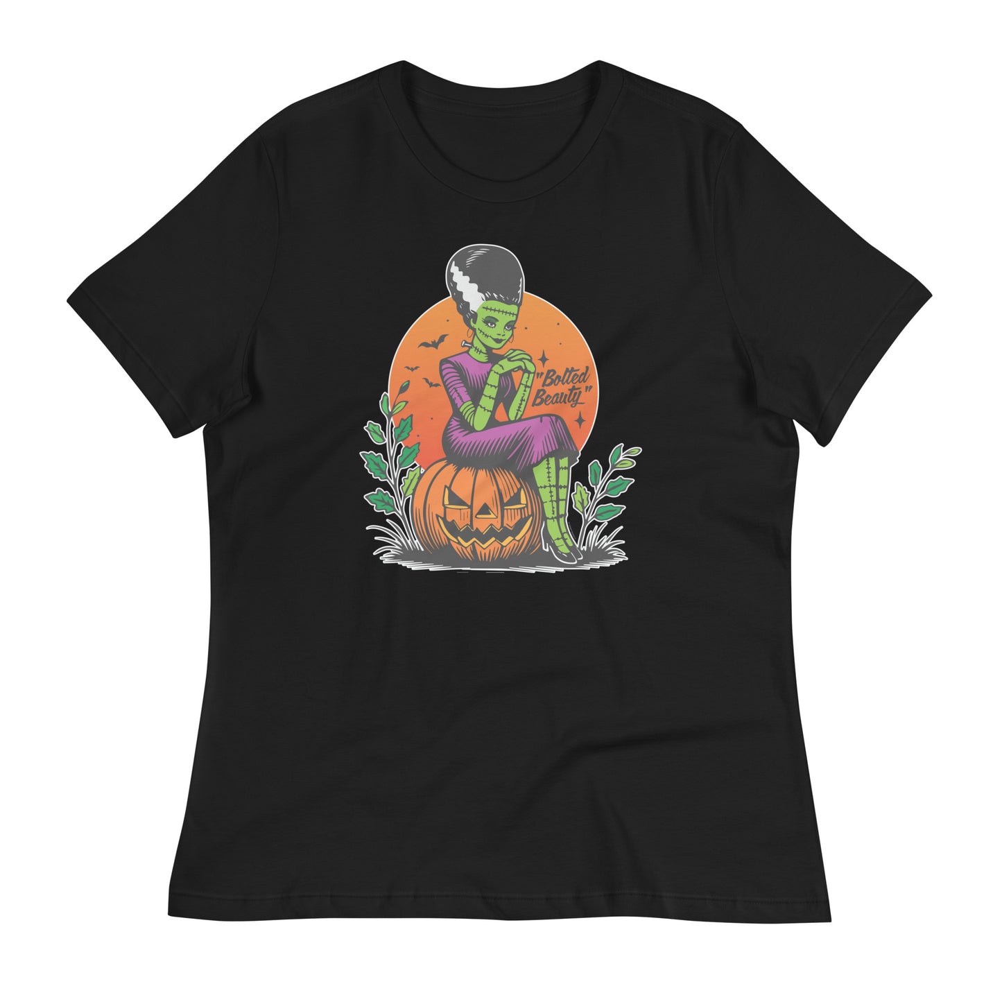 Black t-shirt featuring a vintage Halloween design of a green bride on a jack-o'-lantern with bats flying around. The phrase 'Bolted Beauty' is displayed on the shirt, bringing a retro vibe.