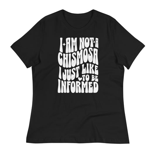 Black t-shirt laid flat showcasing the text based design that says, I'm Not a Chismosa, I just Like to be Informed.