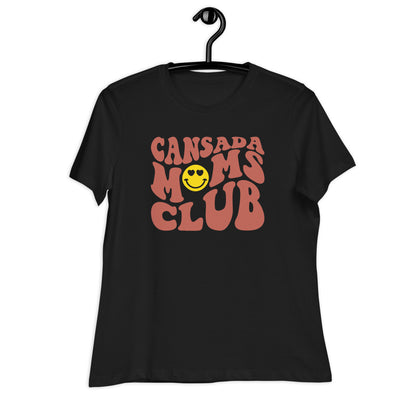 A black tshirt on a hanger with the words Cansada Moms Club with a happy face with hearts.